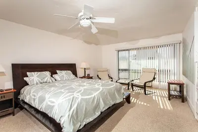 a bedroom with a bed and a ceiling fan at Paradise Awaits - SUR182 in Solana Beach