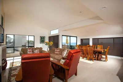 a living room with a couch and a table and chairs at Paradise Awaits - SUR182 in Solana Beach