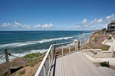 a stairway leading down to the beach with the ocean at Relax & Renew - SONG8 in Solana Beach