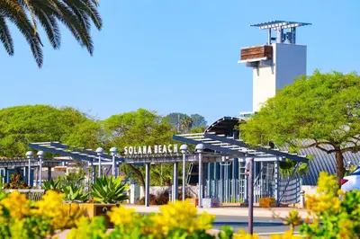 a parking lot with a gate and a control tower at Escape at Seascape - SUR112 in Solana Beach