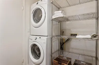 a laundry room with a washer and dryer at Slow M'ocean - DMBC853A in Solana Beach