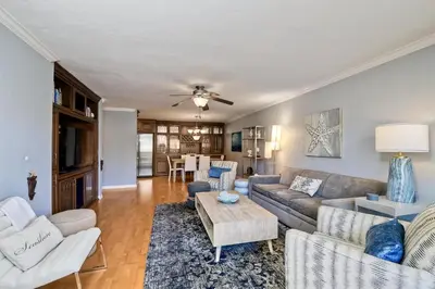 a living room with a couch and a table at Ocean Dreams - SBTC145 in Solana Beach