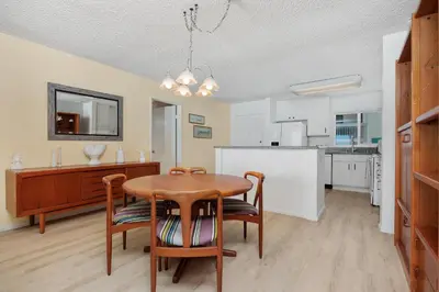 a kitchen and dining room with a table and chairs at Once Upon A Tide - SBTC312 in Solana Beach