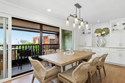 a kitchen and dining room with a wooden table and chairs at Torrey View Hideaway in San Diego