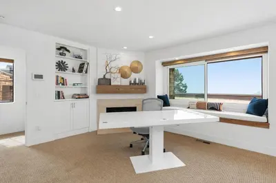 a white office with a desk and a window at Torrey View Hideaway in San Diego