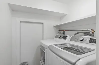 a white washer and dryer in a white room at Torrey View Hideaway in San Diego