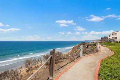 a path to the beach with the ocean in the background at Sea For Miles - SUR93S in Solana Beach