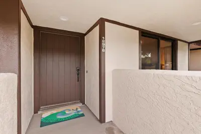 a door to a house with a mat in front of it at Mermaid's Lookout in San Diego