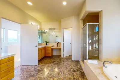 a large bathroom with a sink and a shower at Canyon Paradise in Encinitas