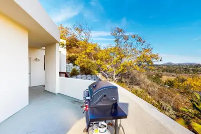 a stroller parked on a balcony of a house at Canyon Paradise in Encinitas