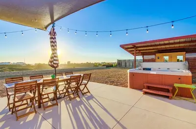 a patio with a hot tub and a table and chairs at Home to enjoy the beach with ocean view in Oceanside