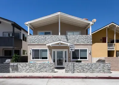 a house with a sign in front of it at Balboa Peninsula Beach House Fireplace Bikes in Newport Beach