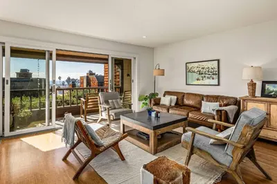 a living room with a couch and a table at Coastal View at Torrey Pines townhouse in San Diego