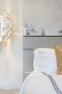 a bedroom with a bed and a painting on the wall at Hotel-Style Independent Suite in Ocean Beach in San Diego