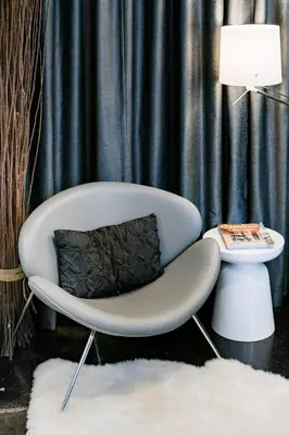 a white chair with a pillow in a room at Hotel-Style Independent Suite in Ocean Beach in San Diego