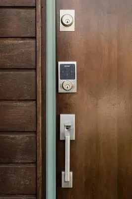 a wooden door with a security device on it at Hotel-Style Independent Suite in Ocean Beach in San Diego
