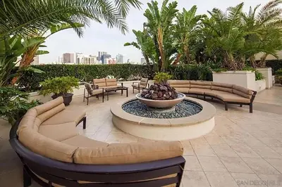 a patio with couches and a fountain with a bowl at Luxurious and Spacious 2-Bedroom Condo Unit Downtown San Diego in the Heart of the Gaslamp Quarter - 14-Day Min in San Diego