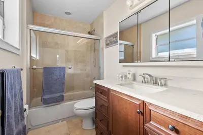 a bathroom with a sink and a toilet and a shower at Ocean Song in San Diego