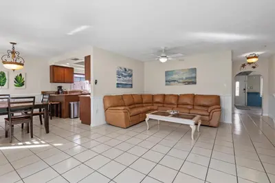 a living room with a couch and a table at Ocean Song in San Diego