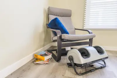 a rocking chair with a dog vacuum in a room at 2BR Retreat Near Balboa Park in San Diego