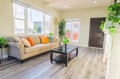 a living room with a couch and a table at 2BR Retreat Near Balboa Park in San Diego