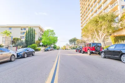 a row of cars parked on the side of a street at 2BR Retreat Near Balboa Park in San Diego