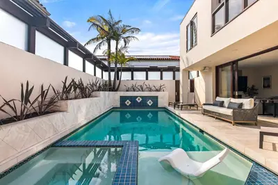 a swimming pool in a house at Brand New Listing Elegant 7BR Masterpiece Walk to Beach Shops & Dining in San Diego