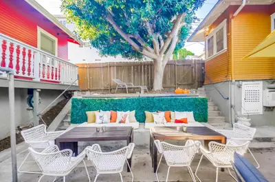 a patio with tables and chairs and a tree at Sunny San Diego Golden Hill Home! Pet Friendly, near DT, Fully Stocked! in San Diego