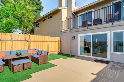 a backyard with a patio furniture and a fence at Balconies and Views Modern Abode in Poway! in Poway