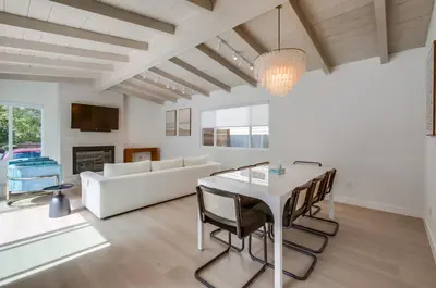 a living room with a table and a couch at Sunset Path La Jolla Shores in San Diego