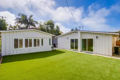 a white house with a large yard at Sunset Path La Jolla Shores in San Diego