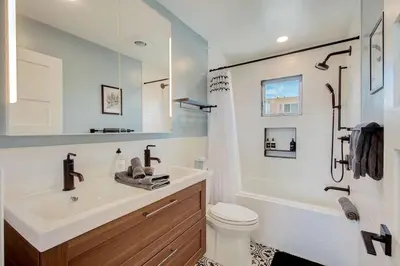 a bathroom with a sink and a toilet and a shower at Ocean View Luxury Beach Homes With AC and Parking in San Diego