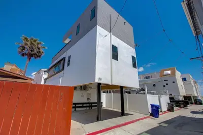 a white building on the side of a street at Ocean View Luxury Beach Homes With AC and Parking in San Diego