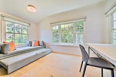 a living room with a bench and two windows at La Jolla Shores Perfection with Hot Tub, Fence Yard, AC & Grill in San Diego