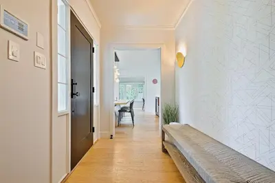 a hallway of a home with a bench and a table at La Jolla Shores Perfection with Hot Tub, Fence Yard, AC & Grill in San Diego
