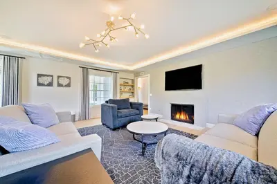 a living room with two couches and a fireplace at La Jolla Shores Perfection with Hot Tub, Fence Yard, AC & Grill in San Diego