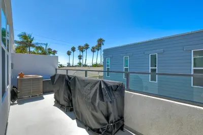 a balcony with a blue building with tarps on it at 301 Cassidy Street Unit 10 in Oceanside