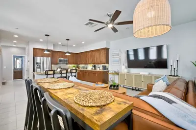 a kitchen and living room with a table and a couch at 301 Cassidy Street Unit 10 in Oceanside