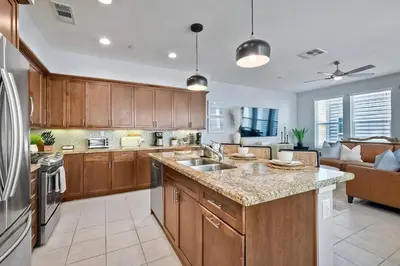 a kitchen with wooden cabinets and a large counter top at 301 Cassidy Street Unit 10 in Oceanside