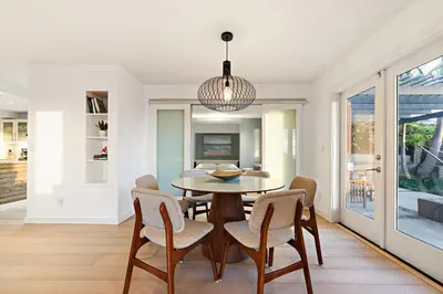 a dining room with a table and chairs at Ocean Views w Stunning Sunsets by the Firepit in San Diego
