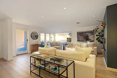 a living room with a couch and a table at Ocean Views w Stunning Sunsets by the Firepit in San Diego