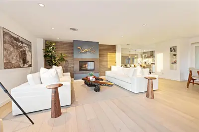 a living room with white couches and a fireplace at Ocean Views w Stunning Sunsets by the Firepit in San Diego