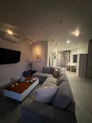 a living room with a couch and a table at Close to Ocean and Beach in San Diego
