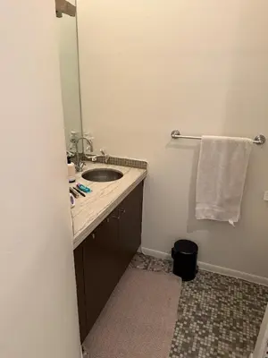a bathroom with a sink and a mirror at Close to Ocean and Beach in San Diego