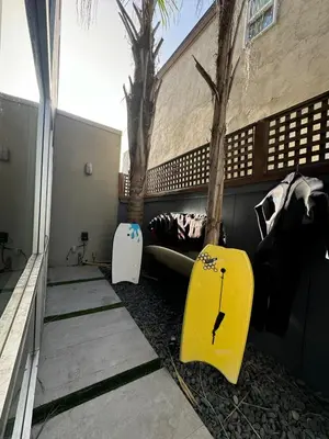 two surfboards sitting on the side of a building at Close to Ocean and Beach in San Diego