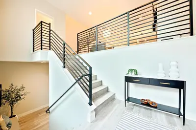 a staircase in a house with white walls at 343 Oak Avenue in Carlsbad