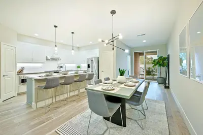 a kitchen and dining room with a table and chairs at 343 Oak Avenue in Carlsbad