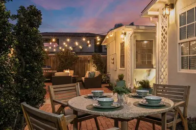 a patio with a table and chairs on a patio at Beachside 1BR Haven Near Ocean & Outdoor Space in San Diego
