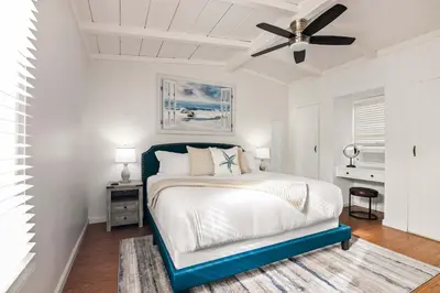 a bedroom with a bed and a ceiling fan at Beachside 1BR Haven Near Ocean & Outdoor Space in San Diego