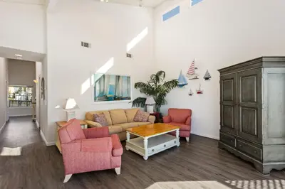 a living room with a couch and two chairs at 1317 S Pacific - Unit A in Oceanside